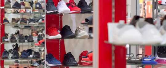 Shoe store with shoe shop windows, reflected in the mirror