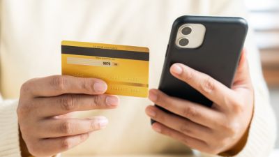 Woman using smart phone pay bill to make online payment or online shopping, cashless payment. 400x225